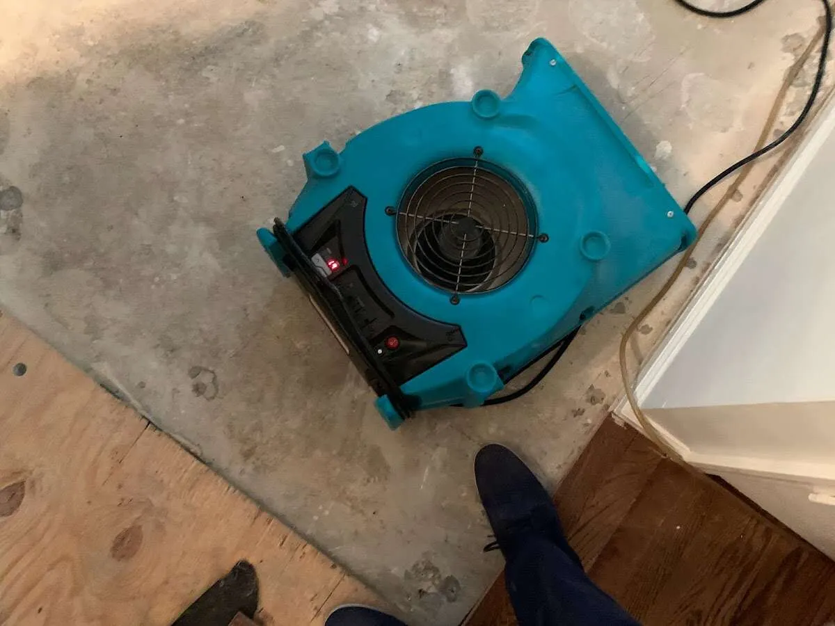 Air mover drying subfloor during Leak Detection & Repair in Shaker Heights